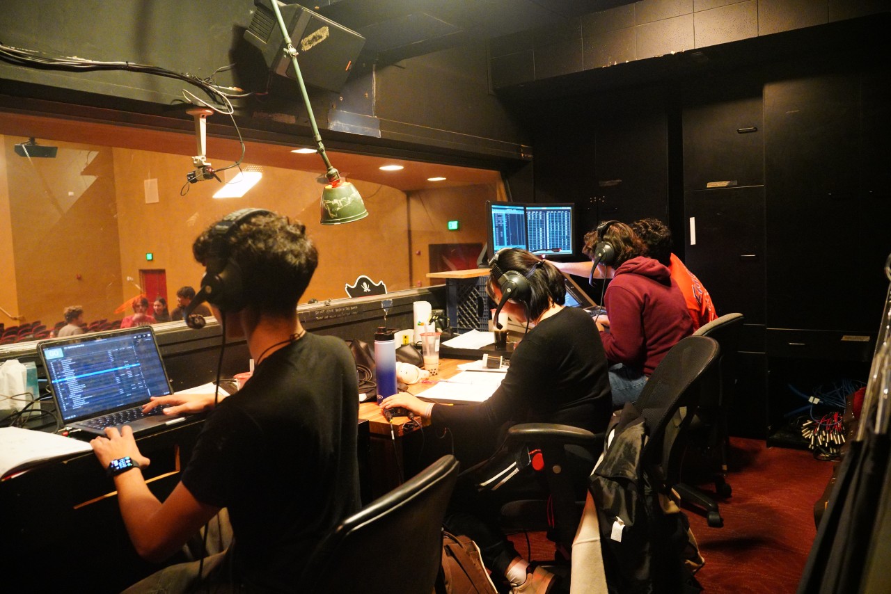 A candid shot of a typical moment in the booth of Stanford's Memorial Auditorium, with the lights on